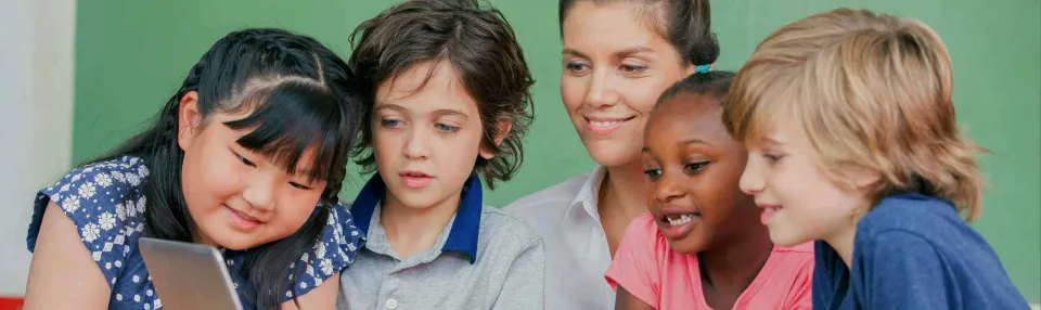 Children reading together with an adult.