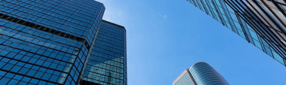 Architectural buildings photographed from street level.