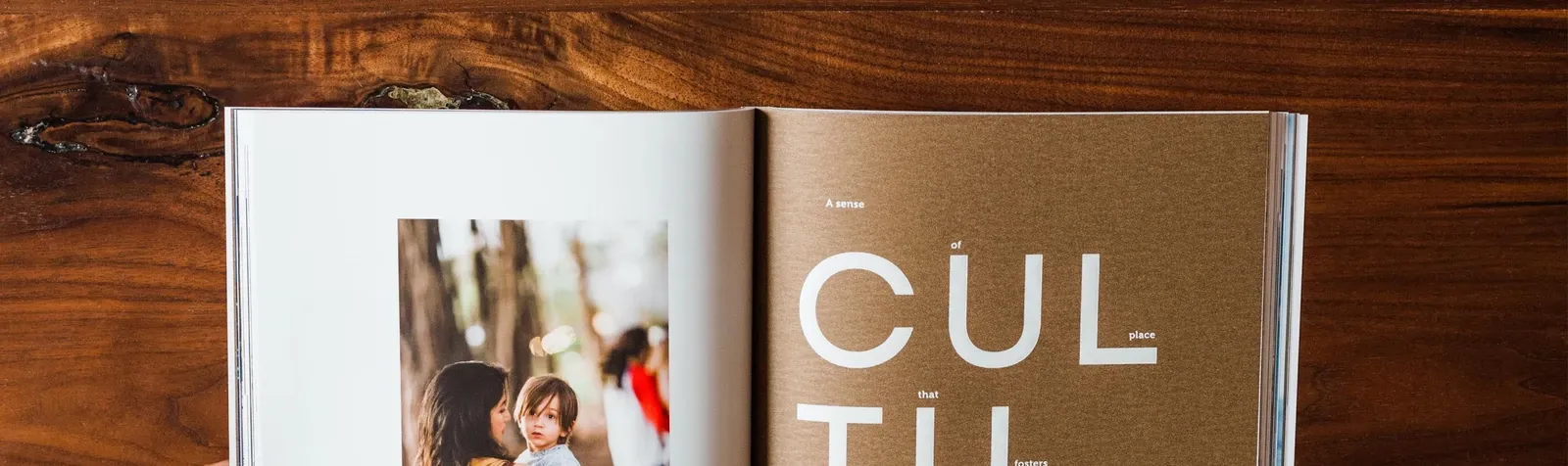 Printed publications displayed on a wooden surface.