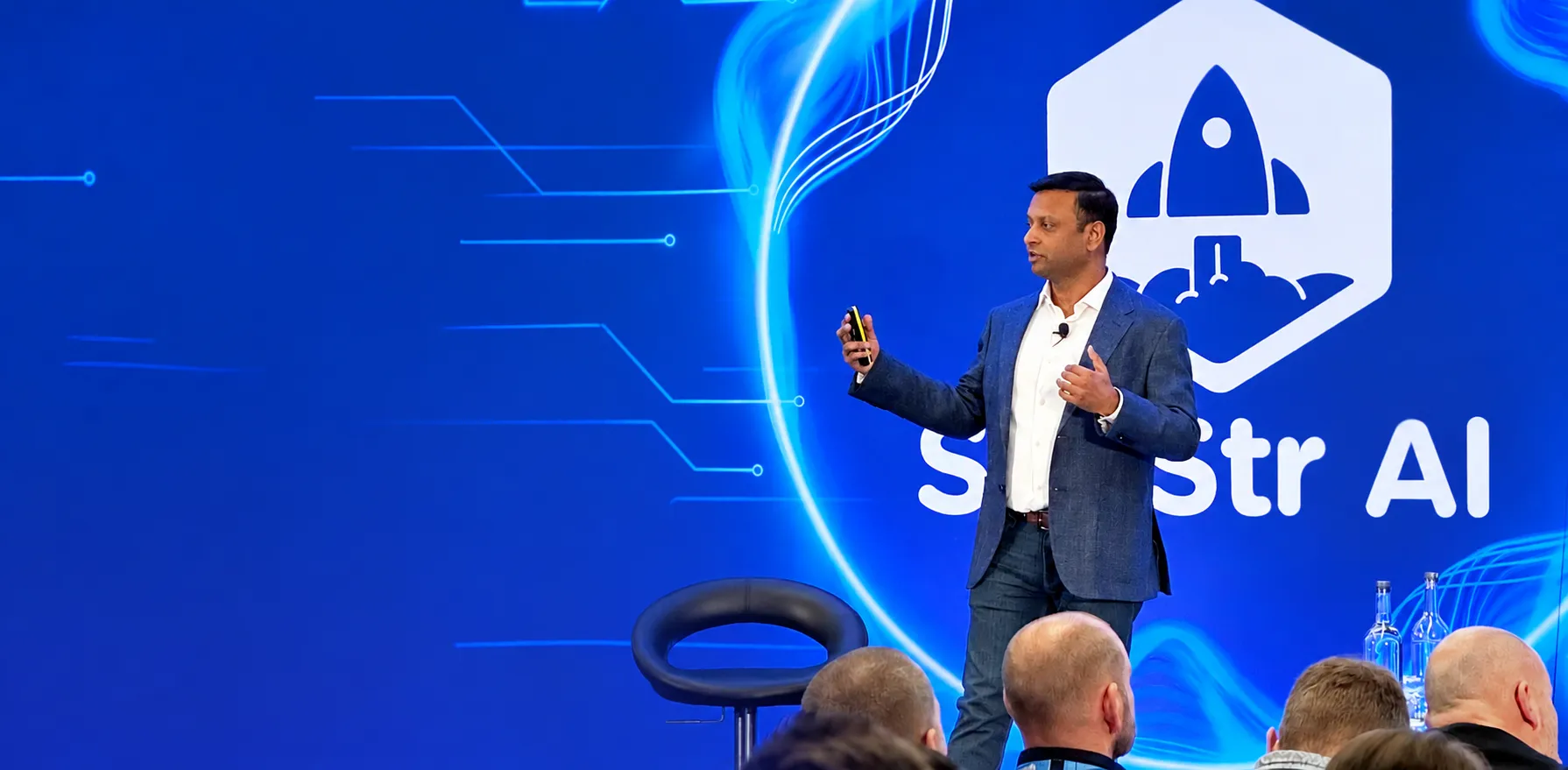 Shalin Jain speaking on stage at SaaStr AI