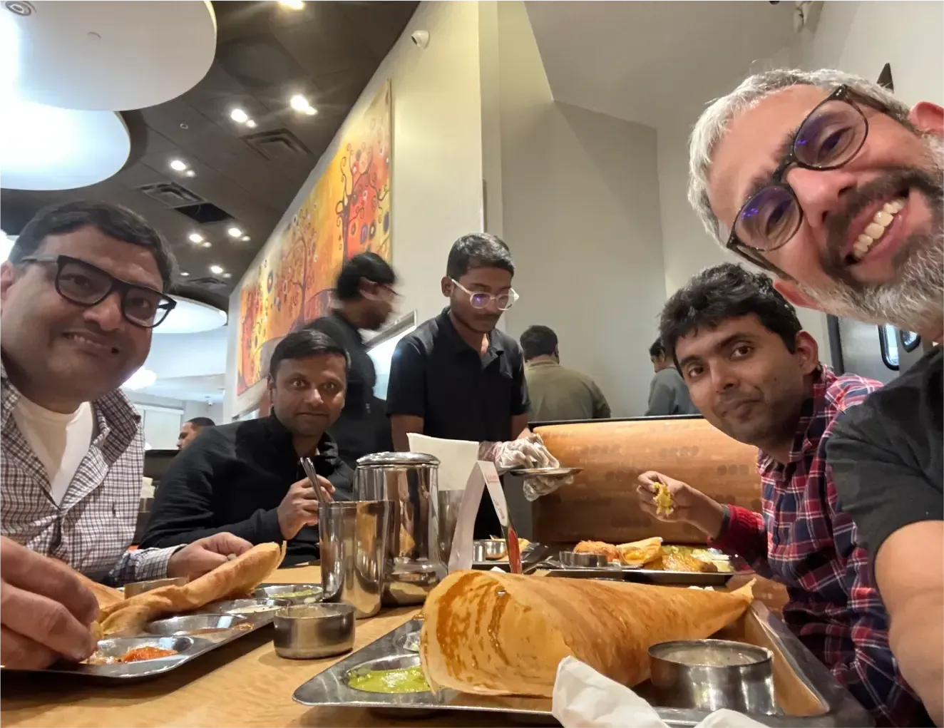 HappyFox colleagues sharing a meal together.