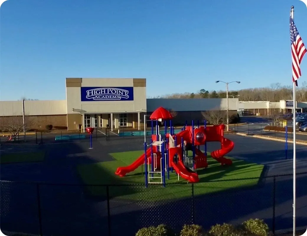 The High Point Academy school building and playground.