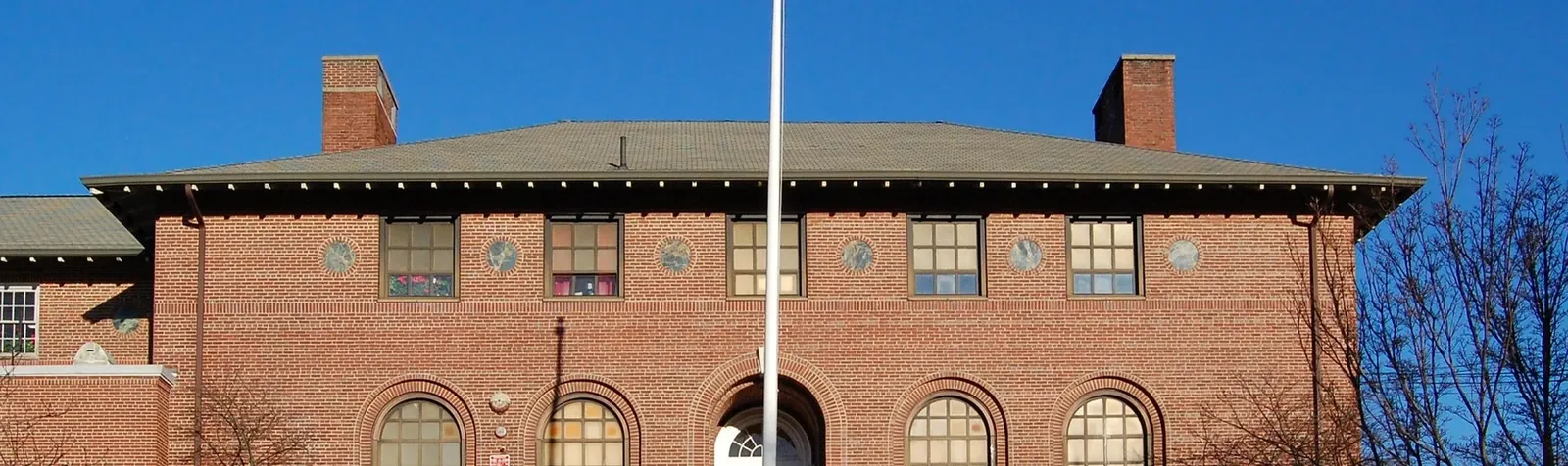 A school entrance and brick facade.