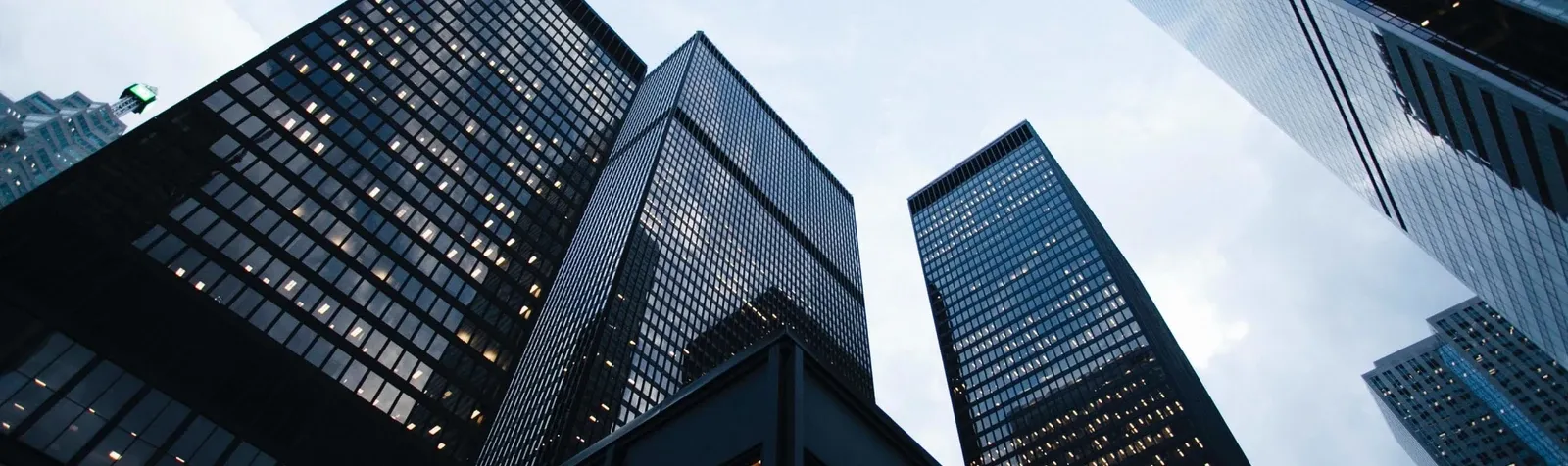 Modern office towers viewed from street level.