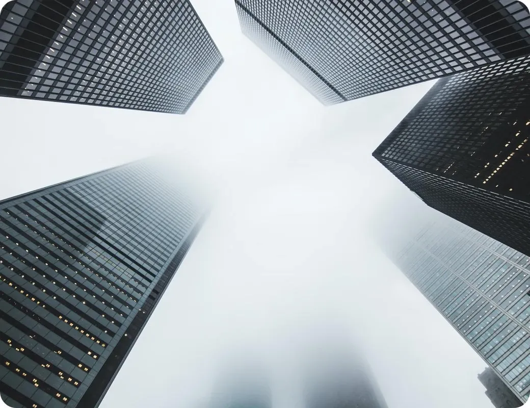 Office towers framing an open sky.