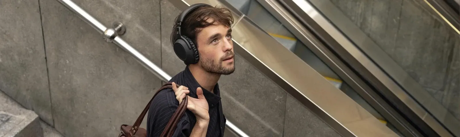 A customer wearing headphones in a public setting.